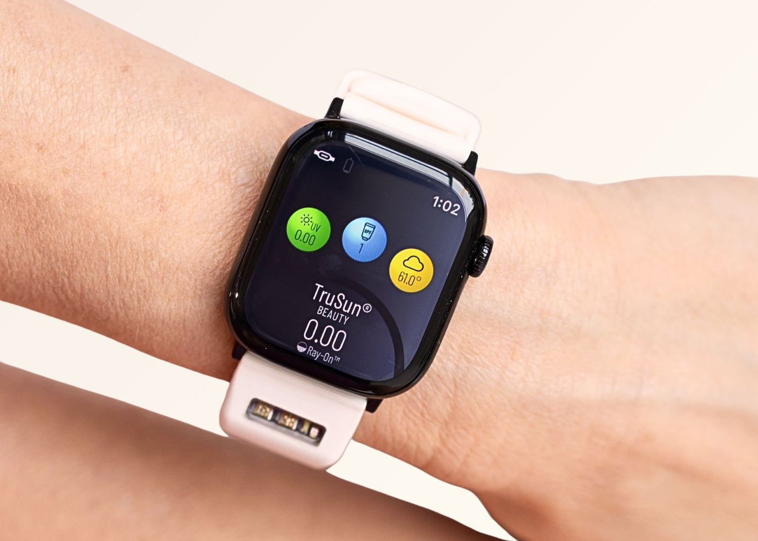 Closeup of Apple Watch with BURŪV band on a wrist with a white strap displaying app icons.