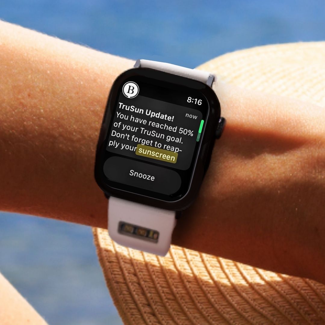 BURŪV app prompt to reapply sunscreen on Apple Watch® against water landscape