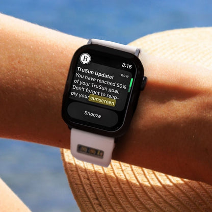 BURŪV app prompt to reapply sunscreen on Apple Watch® against water landscape